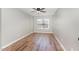 Bedroom with window and neutral walls providing bright natural light at 11700 Coppergate Dr # 100, Raleigh, NC 27614