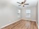 Comfortable bedroom with two windows and a stylish ceiling fan at 11700 Coppergate Dr # 100, Raleigh, NC 27614
