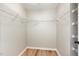 Walk-in closet with shelving units provides ample storage space at 11700 Coppergate Dr # 100, Raleigh, NC 27614