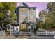 Charming two-story townhome with a white picket fence and well-maintained landscaping at 11700 Coppergate Dr # 100, Raleigh, NC 27614