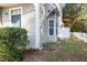 Exterior corner view of the home with manicured landscaping at 11700 Coppergate Dr # 100, Raleigh, NC 27614