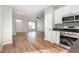 Modern kitchen with stainless steel appliances and an open view to the living area at 11700 Coppergate Dr # 100, Raleigh, NC 27614