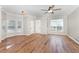 Bright living room with hardwood floors, crown molding, and ample natural light at 11700 Coppergate Dr # 100, Raleigh, NC 27614