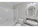 Bathroom featuring a shower-tub combo and a vanity with a white sink and modern fixtures at 11944 Appaloosa E, Raleigh, NC 27613