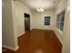 Bright dining room featuring wood floors, chandelier, and a large window bringing in lots of light at 1304 Cozart St # 109, Durham, NC 27704