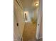 Hallway with plush carpet leading to the staircase and other rooms at 1304 Cozart St # 109, Durham, NC 27704