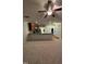 Open concept living room with carpet, ceiling fan, and a view to the kitchen at 1304 Cozart St # 109, Durham, NC 27704