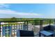 Outdoor balcony with comfortable furniture and scenic treetop views at 140 W Franklin St # 706, Chapel Hill, NC 27516