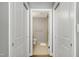 Bright bathroom features a walk-in shower, toilet, and is accessible through double doors at 140 W Franklin St # 706, Chapel Hill, NC 27516