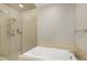 This bathroom features a walk-in shower with multiple shower heads and a soaking tub at 140 W Franklin St # 706, Chapel Hill, NC 27516