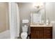 Well-lit bathroom featuring a shower/tub combination, single vanity, and modern fixtures at 140 W Franklin St # 706, Chapel Hill, NC 27516