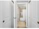 Hallway view of the bathroom with a shower/tub, toilet, and vanity area at 140 W Franklin St # 706, Chapel Hill, NC 27516