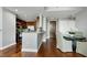 Open concept dining area features a table and seating for four and views of the kitchen at 140 W Franklin St # 706, Chapel Hill, NC 27516