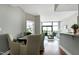 Open-concept floor plan with dining area next to the living area and expansive views at 140 W Franklin St # 706, Chapel Hill, NC 27516