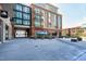 Exterior shot of a commercial building with a brick facade and modern architecture in daytime at 140 W Franklin St # 706, Chapel Hill, NC 27516