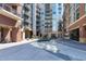 Complex with a brick facade and modern architecture, with multiple balconies at 140 W Franklin St # 706, Chapel Hill, NC 27516