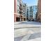 Building exterior featuring brick facade, modern design, multiple balconies, and commercial storefronts at 140 W Franklin St # 706, Chapel Hill, NC 27516