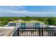 Apartment building with a rooftop garden and views of the surrounding treetops on a sunny day at 140 W Franklin St # 706, Chapel Hill, NC 27516