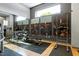 Modern gym with weight racks, exercise bench, and pull-up station at 140 W Franklin St # 706, Chapel Hill, NC 27516