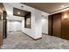 Hallway with doors, overhead lighting, decorative carpet, and neutral wall colors at 140 W Franklin St # 706, Chapel Hill, NC 27516