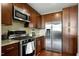 Modern kitchen boasts stainless steel appliances, granite countertops, and a sleek gas range oven at 140 W Franklin St # 706, Chapel Hill, NC 27516