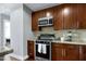 Modern kitchen boasts stainless steel appliances, granite countertops, and a sleek gas range oven at 140 W Franklin St # 706, Chapel Hill, NC 27516