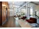 Grand lobby with elevators, tile floor, seating, a high ceiling, and large windows at 140 W Franklin St # 706, Chapel Hill, NC 27516