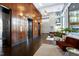 Grand lobby with elevators, tile floor, seating, a high ceiling, and large windows at 140 W Franklin St # 706, Chapel Hill, NC 27516