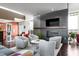 Bright lounge area with comfortable seating, a fireplace, and a large television at 140 W Franklin St # 706, Chapel Hill, NC 27516
