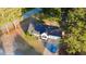 Aerial view of the home showcasing its mature trees and spacious lot in a serene neighborhood at 15 Colonial Hills Dr, Lillington, NC 27546