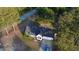 Aerial view of the home showcasing its mature trees and spacious lot in a serene neighborhood at 15 Colonial Hills Dr, Lillington, NC 27546