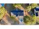 Discover this home from above, nestled among lush trees with a private driveway and a spacious yard at 15 Colonial Hills Dr, Lillington, NC 27546