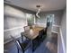 Dining room with modern light fixture over a wooden table with seating for six at 15 Colonial Hills Dr, Lillington, NC 27546