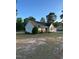Charming single-story home featuring a well-manicured lawn and a convenient two-car garage at 15 Colonial Hills Dr, Lillington, NC 27546