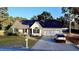 Charming single-Gathering home with a well-maintained lawn, two-car garage, and covered porch at 15 Colonial Hills Dr, Lillington, NC 27546