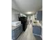 A bright kitchen featuring granite countertops, stainless appliances, and modern lighting at 15 Colonial Hills Dr, Lillington, NC 27546