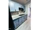Kitchen featuring modern cabinetry, granite countertops, and a gas cooktop at 15 Colonial Hills Dr, Lillington, NC 27546