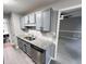 View of a modern kitchen featuring granite countertops and stainless steel appliances at 15 Colonial Hills Dr, Lillington, NC 27546
