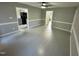 Living room featuring updated floors, fresh paint, and an open transition to the kitchen at 15 Colonial Hills Dr, Lillington, NC 27546