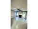 Spacious living room featuring modern floors, fireplace, lots of natural light, and a ceiling fan at 15 Colonial Hills Dr, Lillington, NC 27546