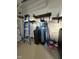 Organized utility area featuring shelving, ladder, and a water softener system at 15 Colonial Hills Dr, Lillington, NC 27546