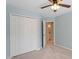 Bedroom featuring a closet with bi-fold doors and access to a full bathroom at 15 Epping Ct, Durham, NC 27703