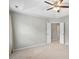 Large bedroom with a ceiling fan and a door to what could be a walk-in closet at 15 Epping Ct, Durham, NC 27703