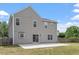 Exterior of a two-story house with a backyard featuring a large concrete patio at 15 Epping Ct, Durham, NC 27703
