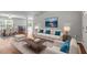 Spacious living area with neutral tones, stylish furnishings, and ample natural light, perfect for relaxation and entertaining at 15 Epping Ct, Durham, NC 27703