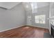 Bright living room with vaulted ceiling, hardwood flooring, fireplace, and lots of natural light at 15 Epping Ct, Durham, NC 27703