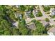 Aerial view showcasing the home in a neighborhood with mature trees and well-maintained lawns at 1608 Hayesville Dr, Fuquay Varina, NC 27526