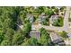 Aerial shot showcasing the home among mature trees and well-maintained properties in neighborhood at 1608 Hayesville Dr, Fuquay Varina, NC 27526