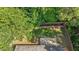 Aerial view of the backyard showing lush greenery, wooden fence, and patio at 1608 Hayesville Dr, Fuquay Varina, NC 27526