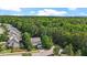 Aerial view of a neighborhood with mature trees and well-kept homes at 1608 Hayesville Dr, Fuquay Varina, NC 27526